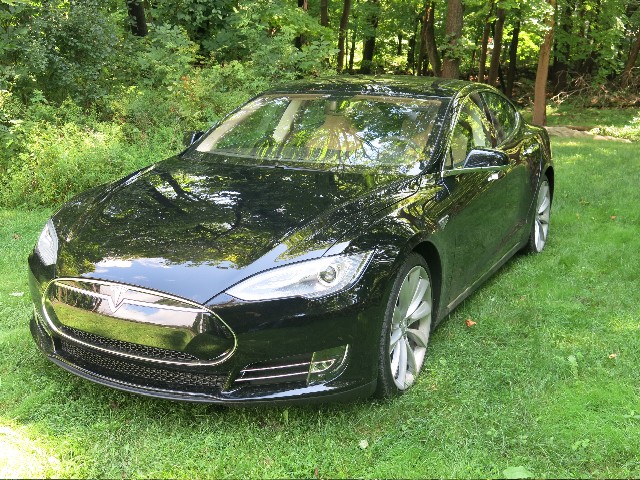 Tesla Model S P85 service loaner vehicle parked at a service center