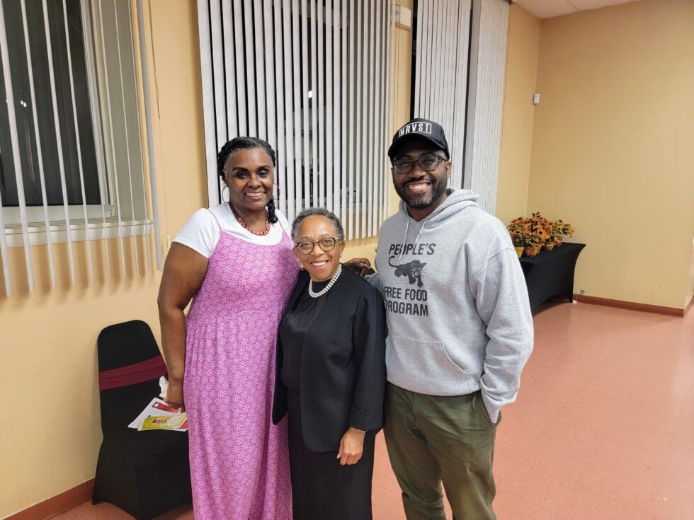 Mrs. Sonia Eaddy leading the Poppleton community meeting, advocating for residents' rights and against gentrification.