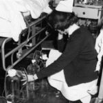 Nurse examining chest tube drainage bottles, Hospital of the University of Pennsylvania, 1972