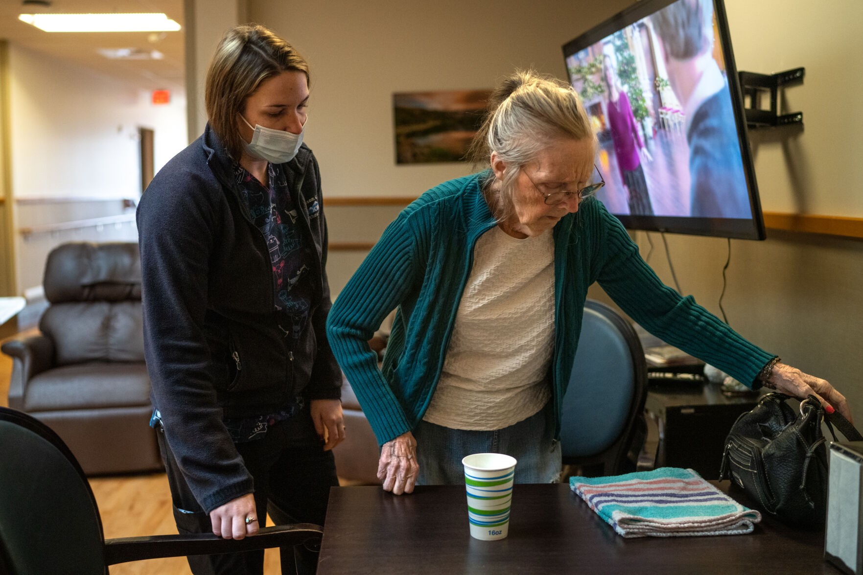 Sadie Cohee, a Certified Nursing Assistant at Amie Holt Care Center, working on a computer, highlighting the important role of CNAs in modern healthcare.