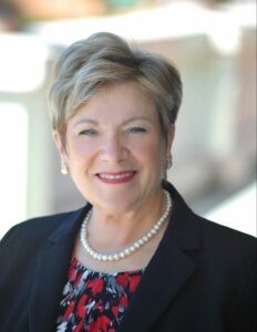 Linda DiGabriele headshot wearing business attire, showcasing her expertise and long career in theatre management.