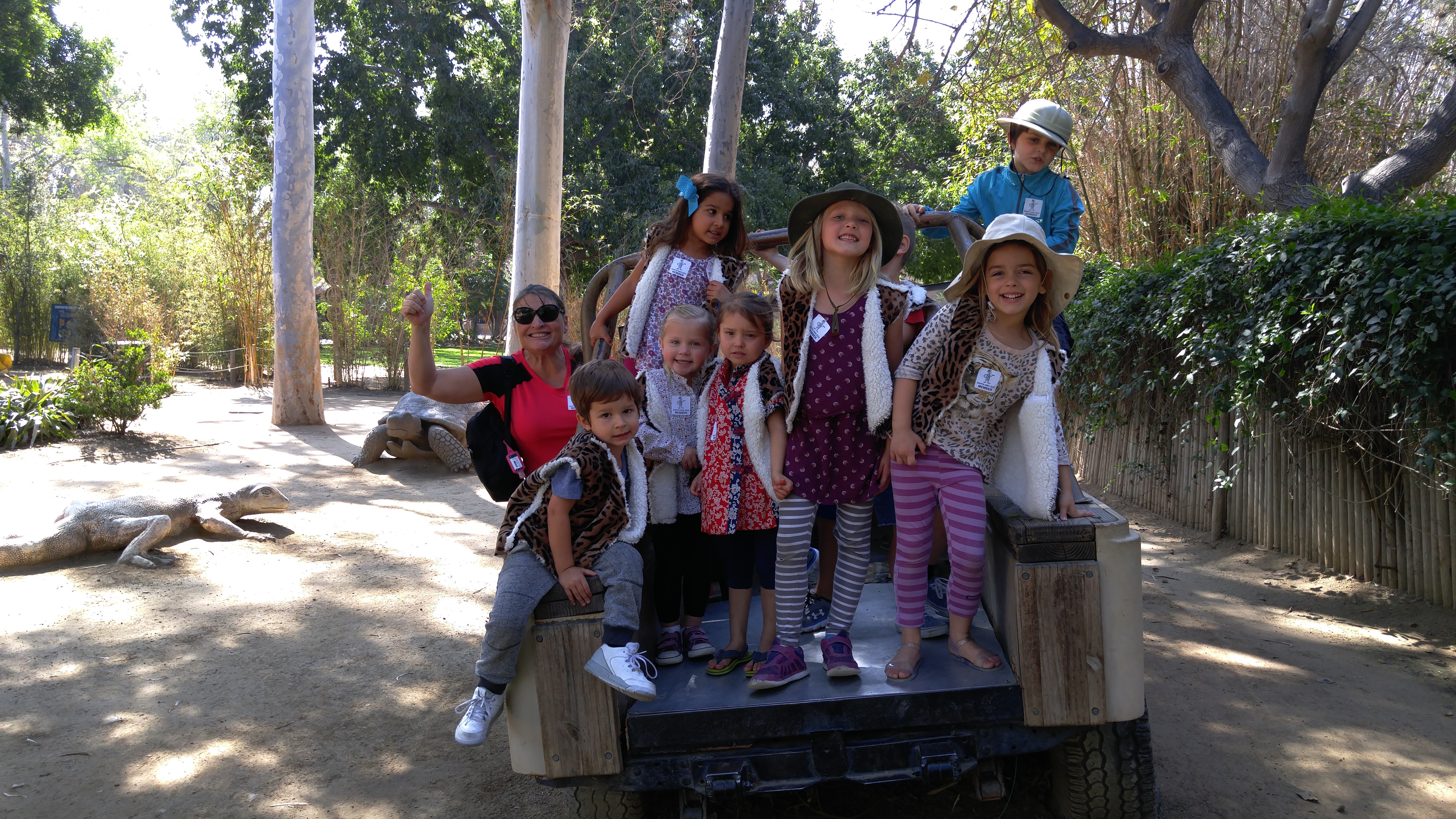 Children riding on a toy truck, enjoying outdoor playtime at Ardenwald Preschool