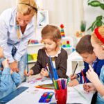 Children engaging in arts and crafts activities at an after school care program, highlighting the supervised and enriching environment these programs offer at varying costs.