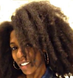 Smiling woman with healthy natural hair