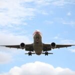 Airplane landing approach at airport, showcasing pilot career aspiration