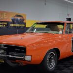 General Lee Dodge Charger tribute car at a classic car show.