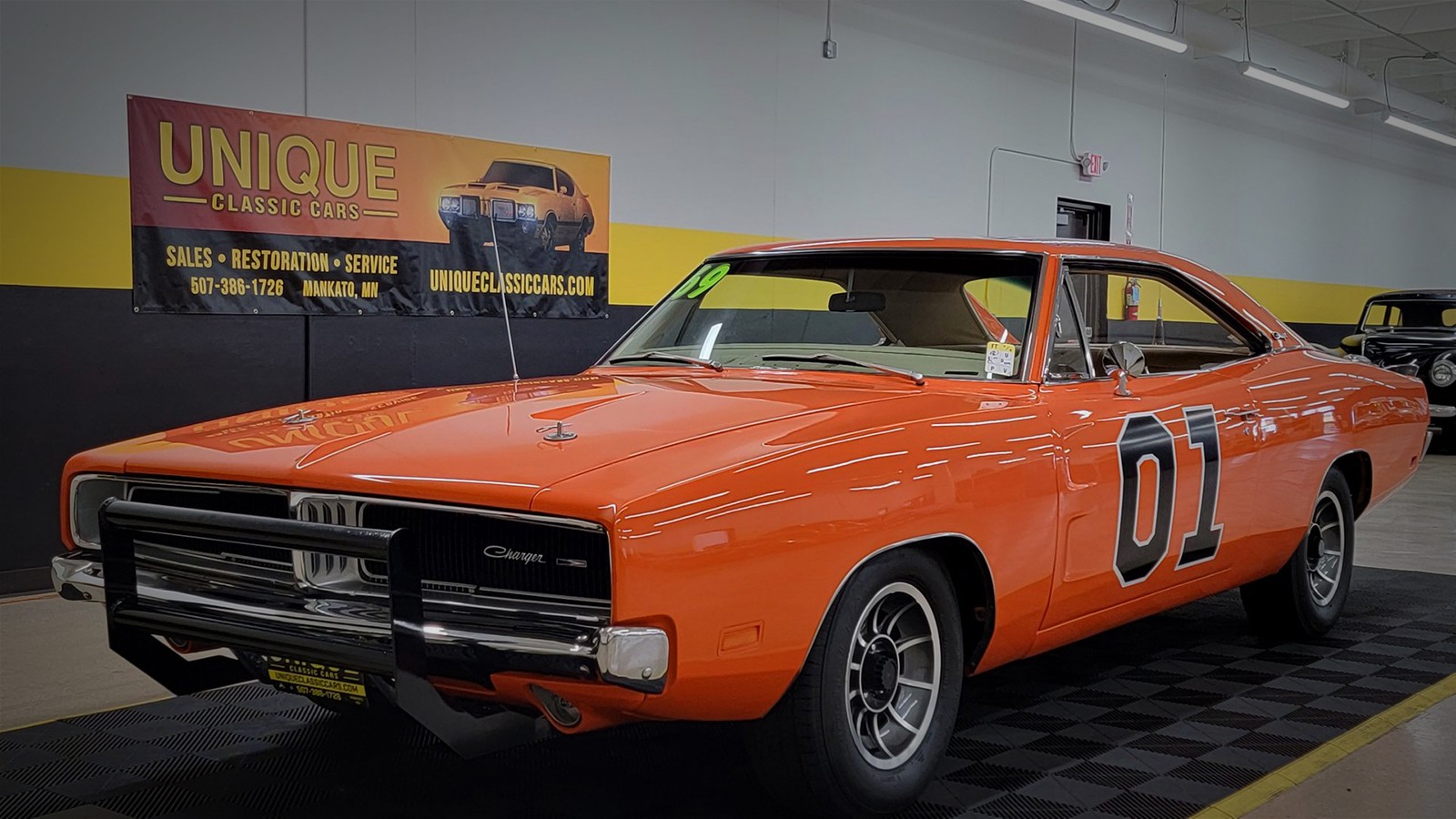 General Lee Dodge Charger tribute car at a classic car show.